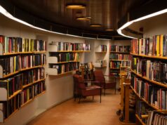 chair beside book shelves